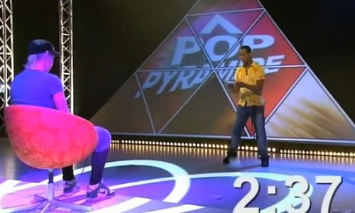 Cook holding glass of red wine